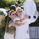 Guests posing for a handheld roaming photo booth in Glenwood Springs