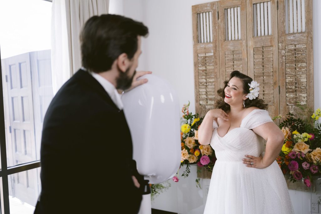 Bride laughing beside the groom at the AIRi open-air wedding photo booth